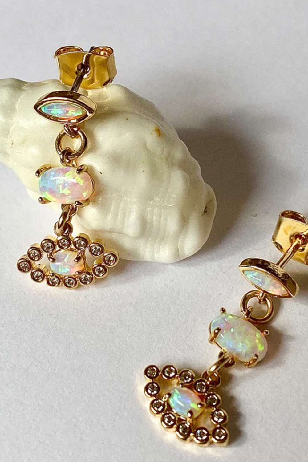 gold sister saturan returns earrings